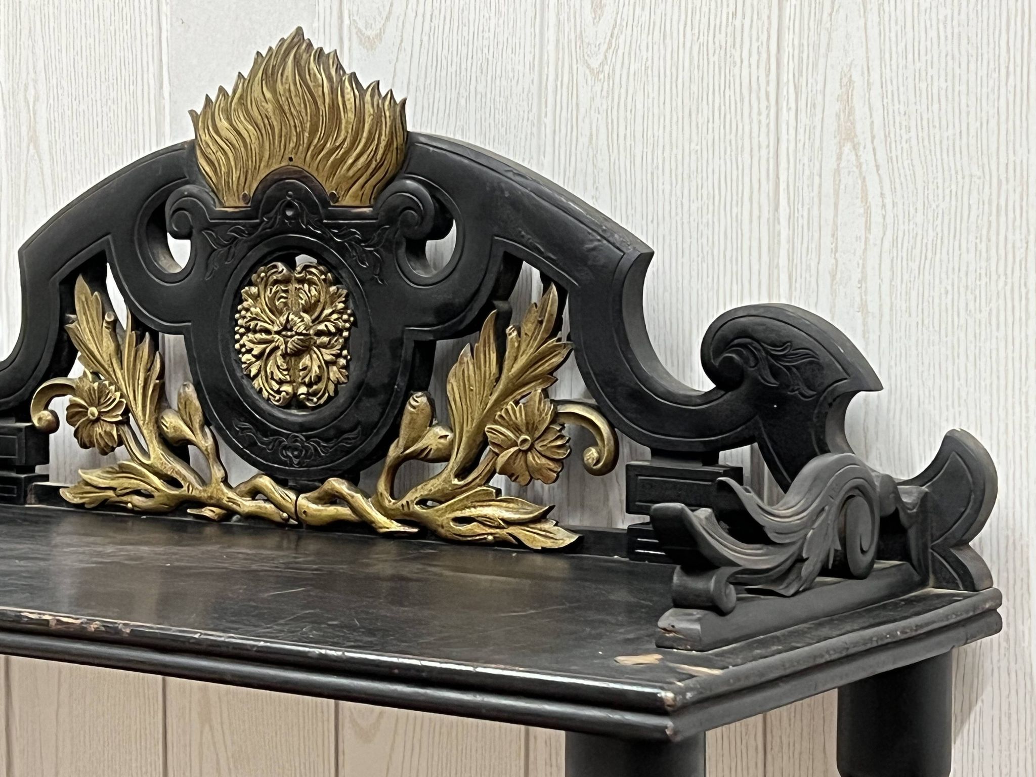 Blackened wooden shelf.