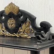 Blackened wooden shelf.