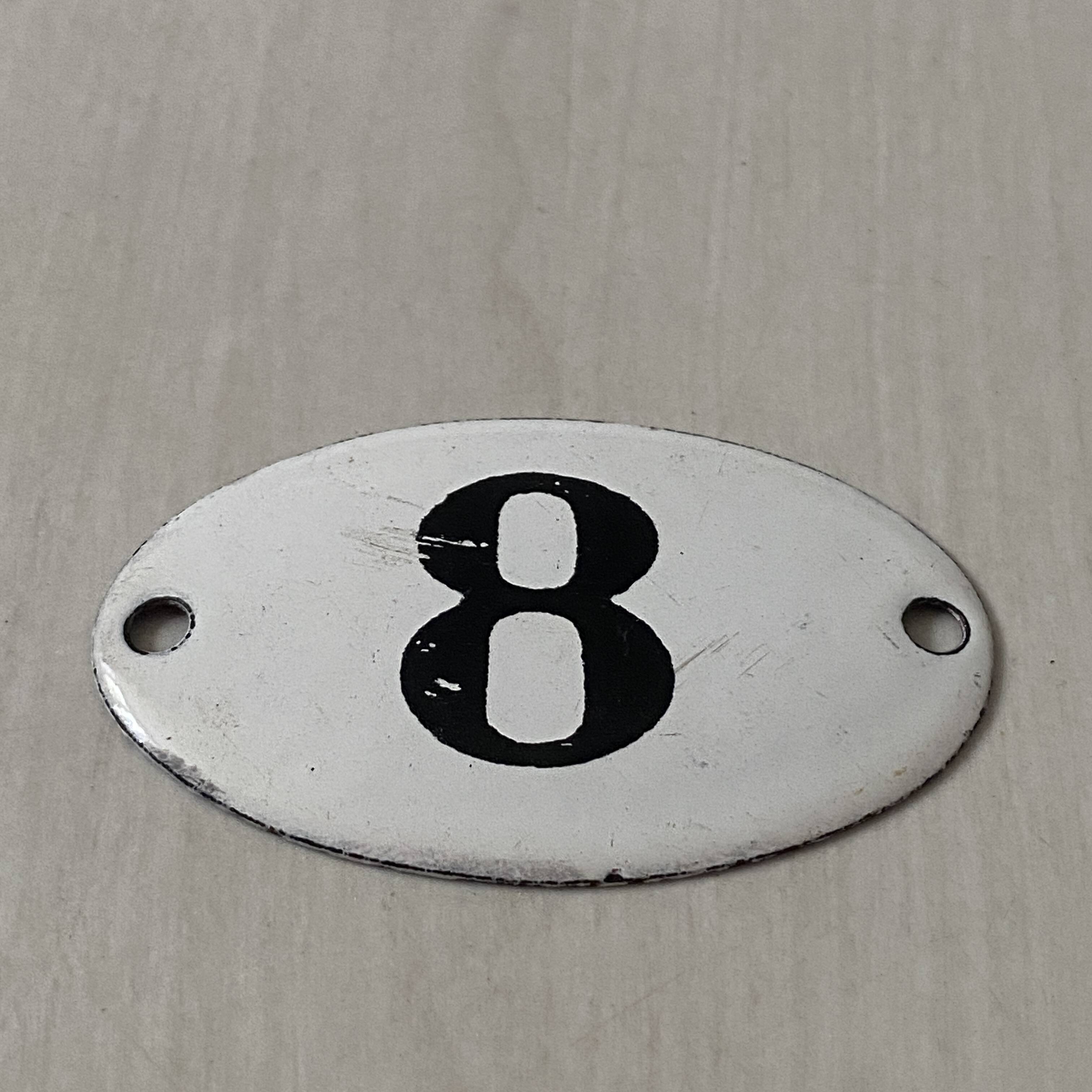 Small old enameled plaque number 8