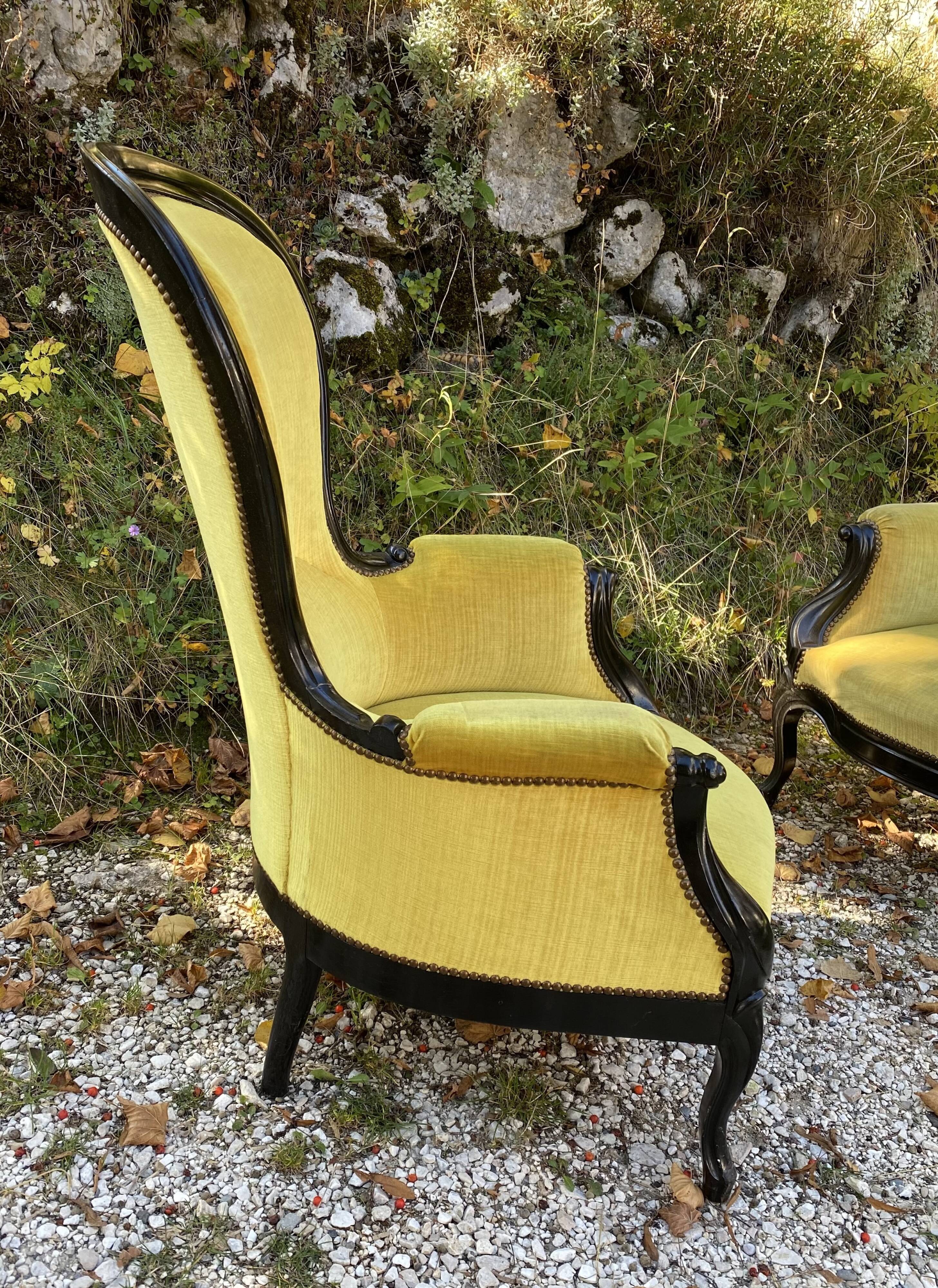 Pair of 19th century armchairs in black lacquered wood