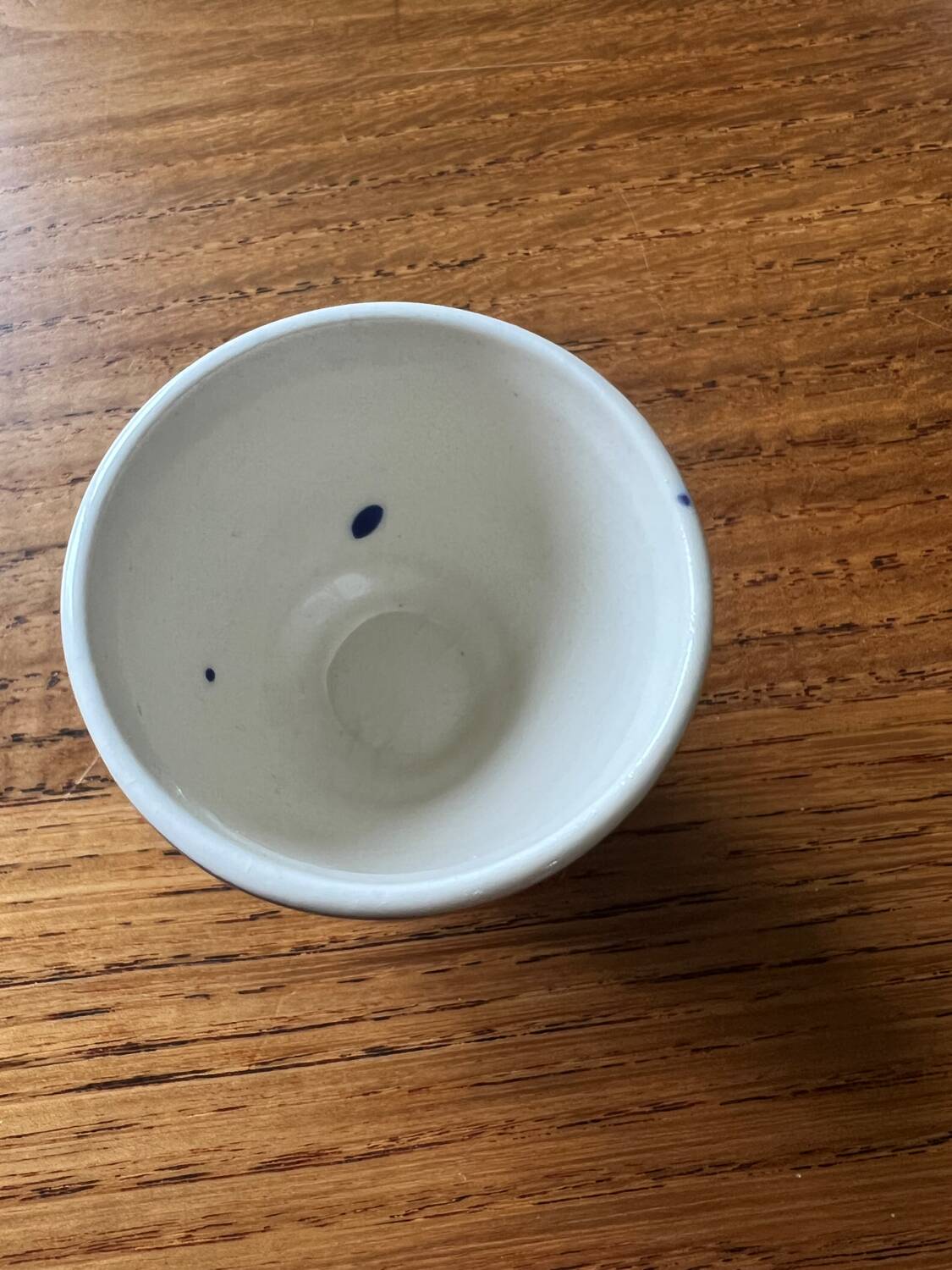 Set of 4 vintage egg cups and salt shaker in blue Delft pottery.