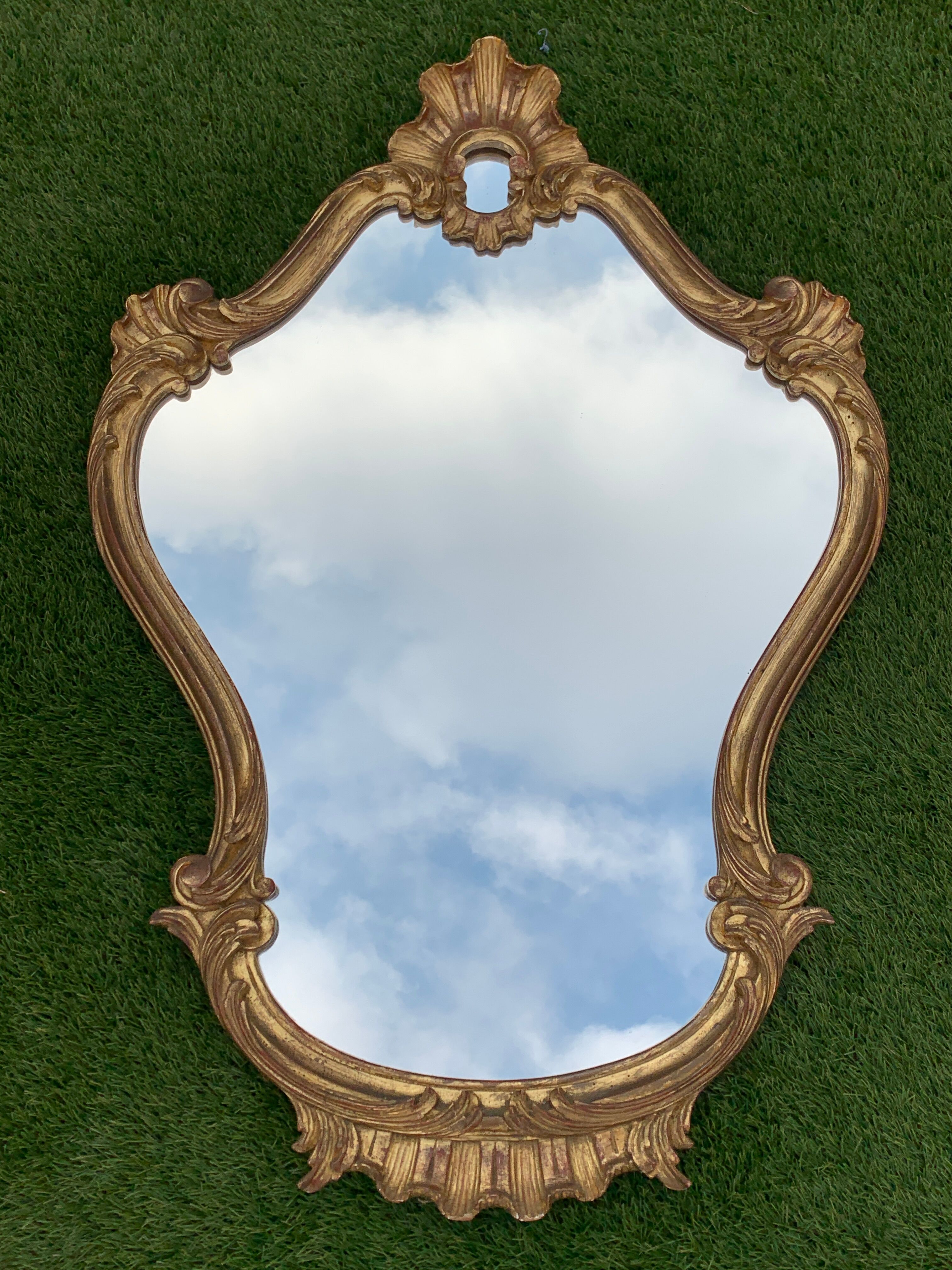 Old mirror in carved wood and gilded leaf, Louis XV rocaille style, twentieth century 59x87cm