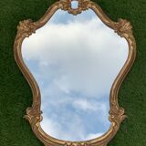Old mirror in carved wood and gilded leaf, Louis XV rocaille style, twentieth century 59x87cm