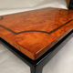 Vintage black lacquered coffee table with elm burl wood top and marquetry