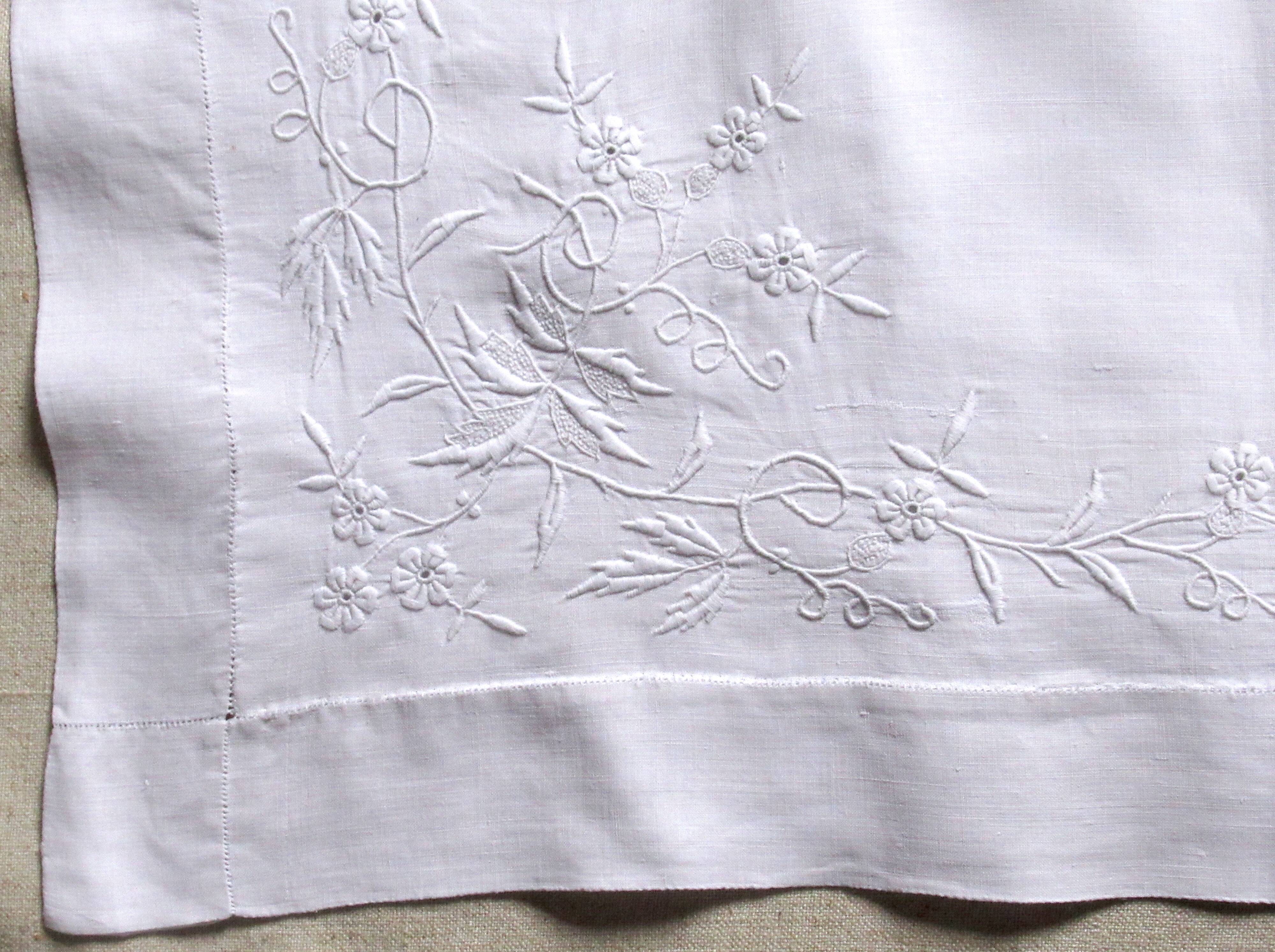 old pillowcase embroidered with fine flowers, marked MP, 19th
