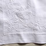 old pillowcase embroidered with fine flowers, marked MP, 19th