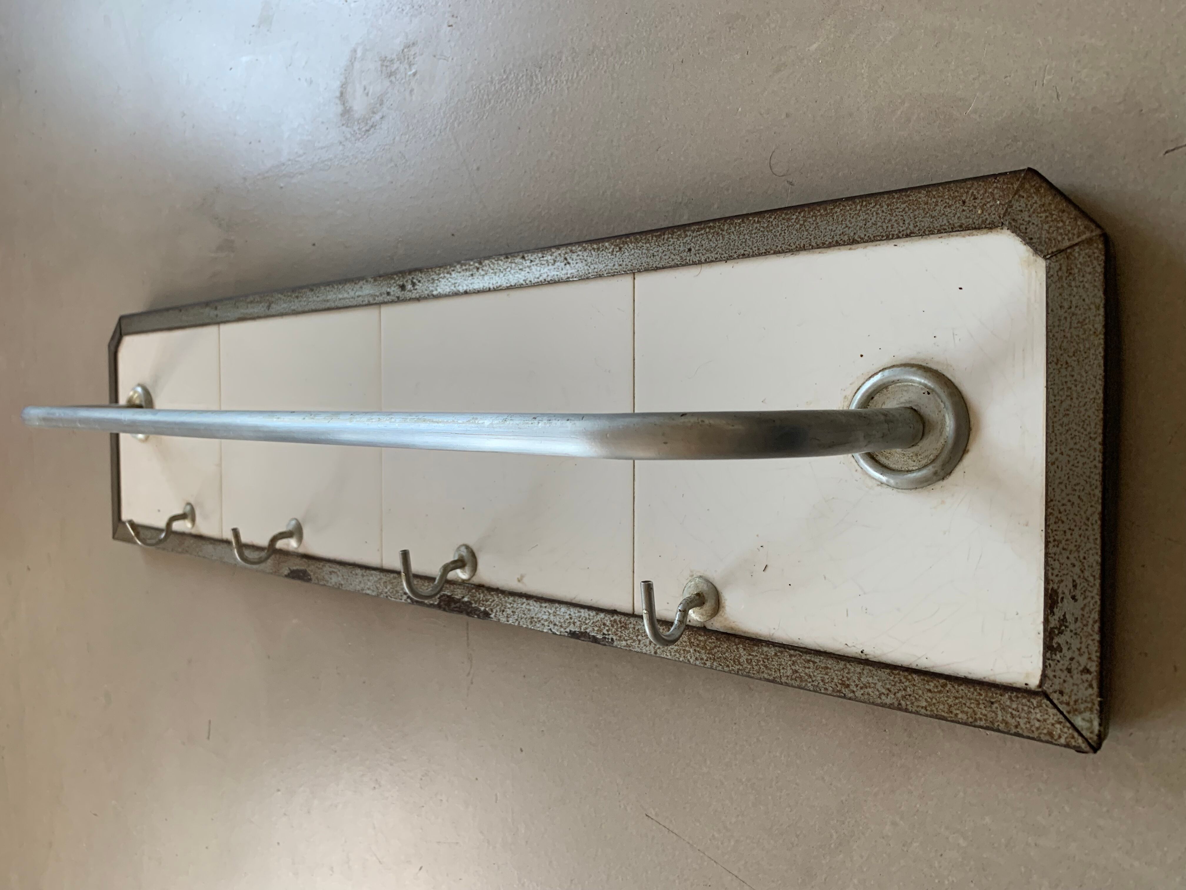 Antique tiled tea towel holder