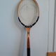Wooden Dunlop tennis racket with its cover