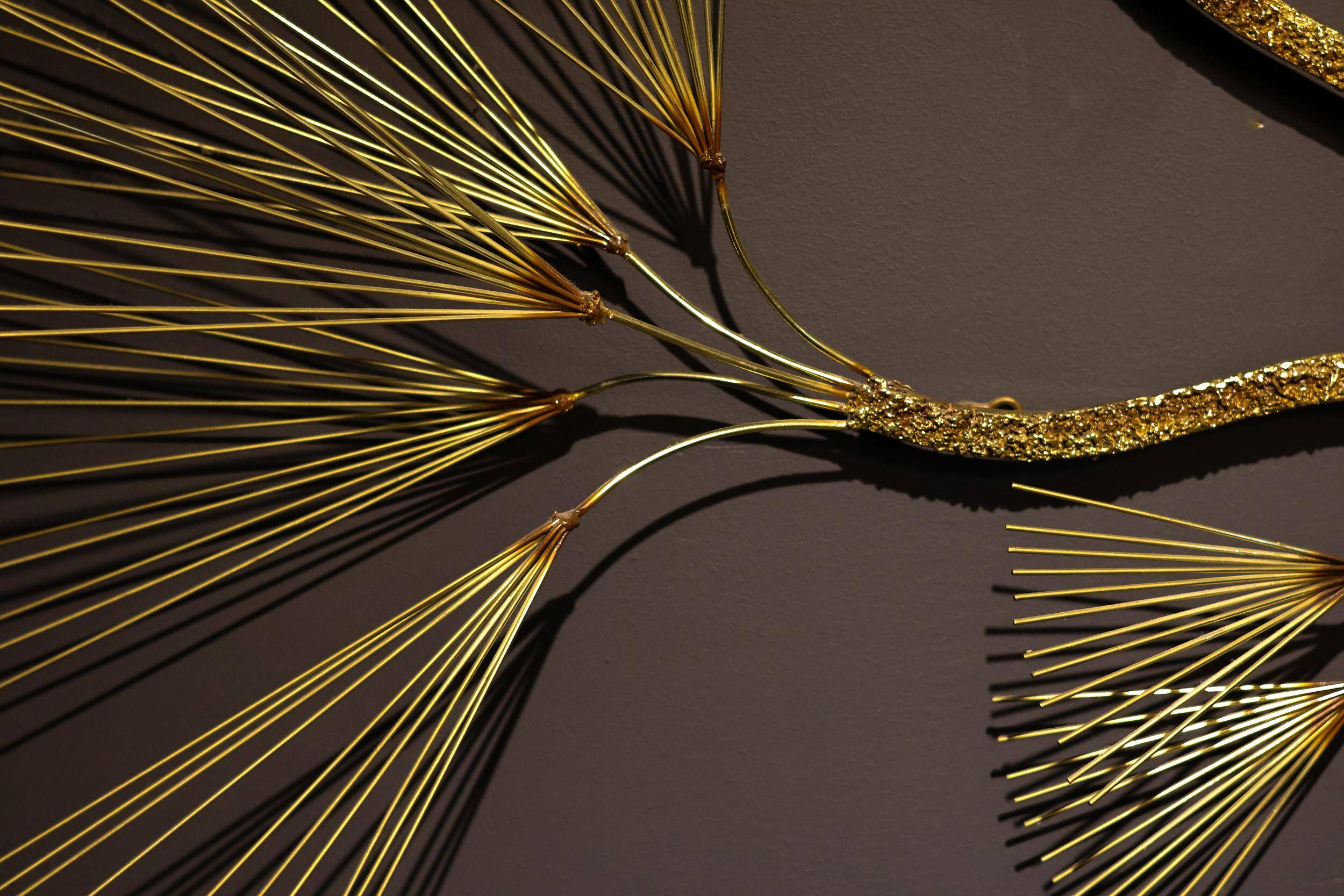 Large wall sculpture in the shape of a tree needle in brass by Curtis Jeré, mid-century modern.