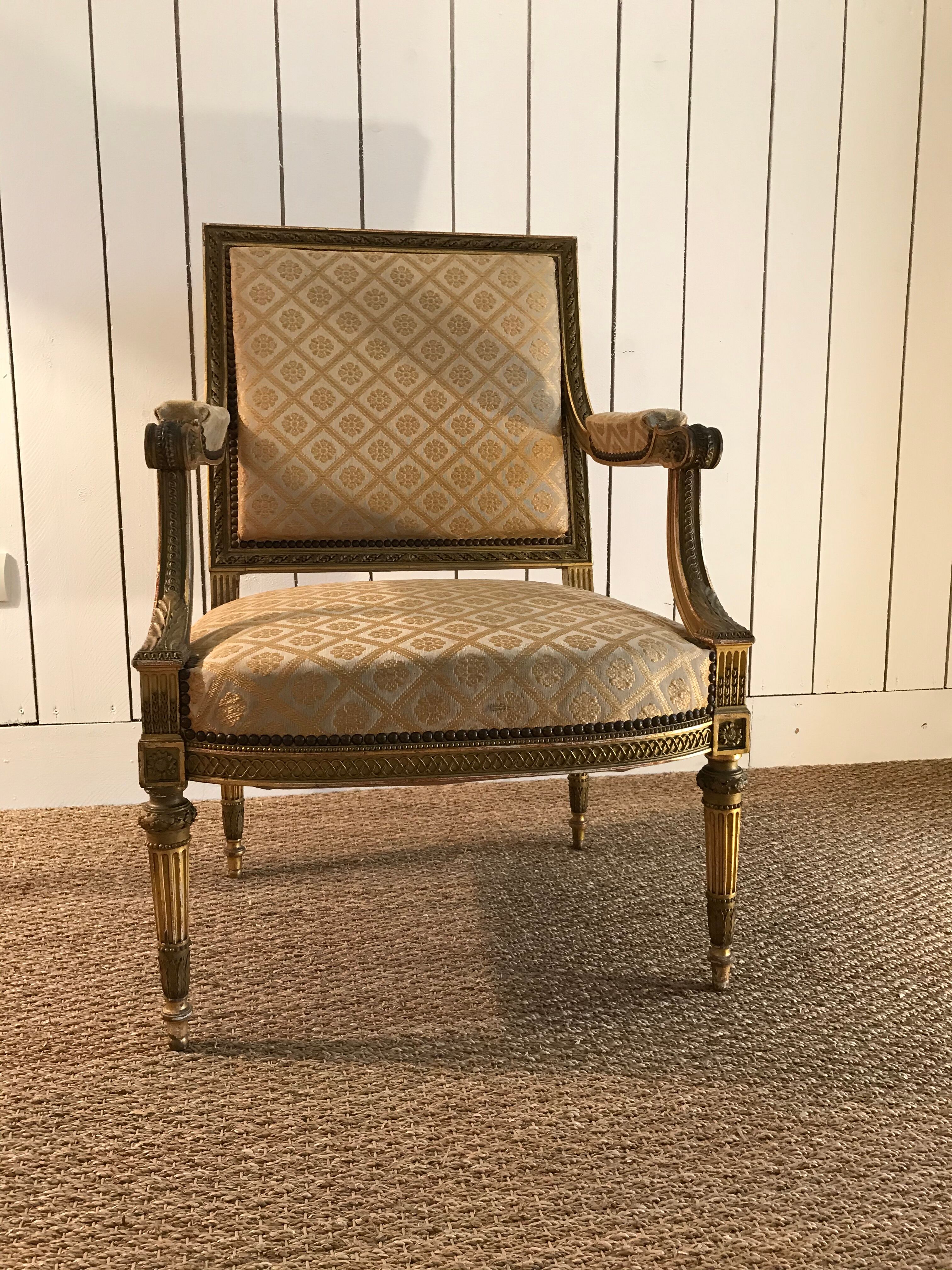 Louis XVI armchair in gilded wood carved and molded