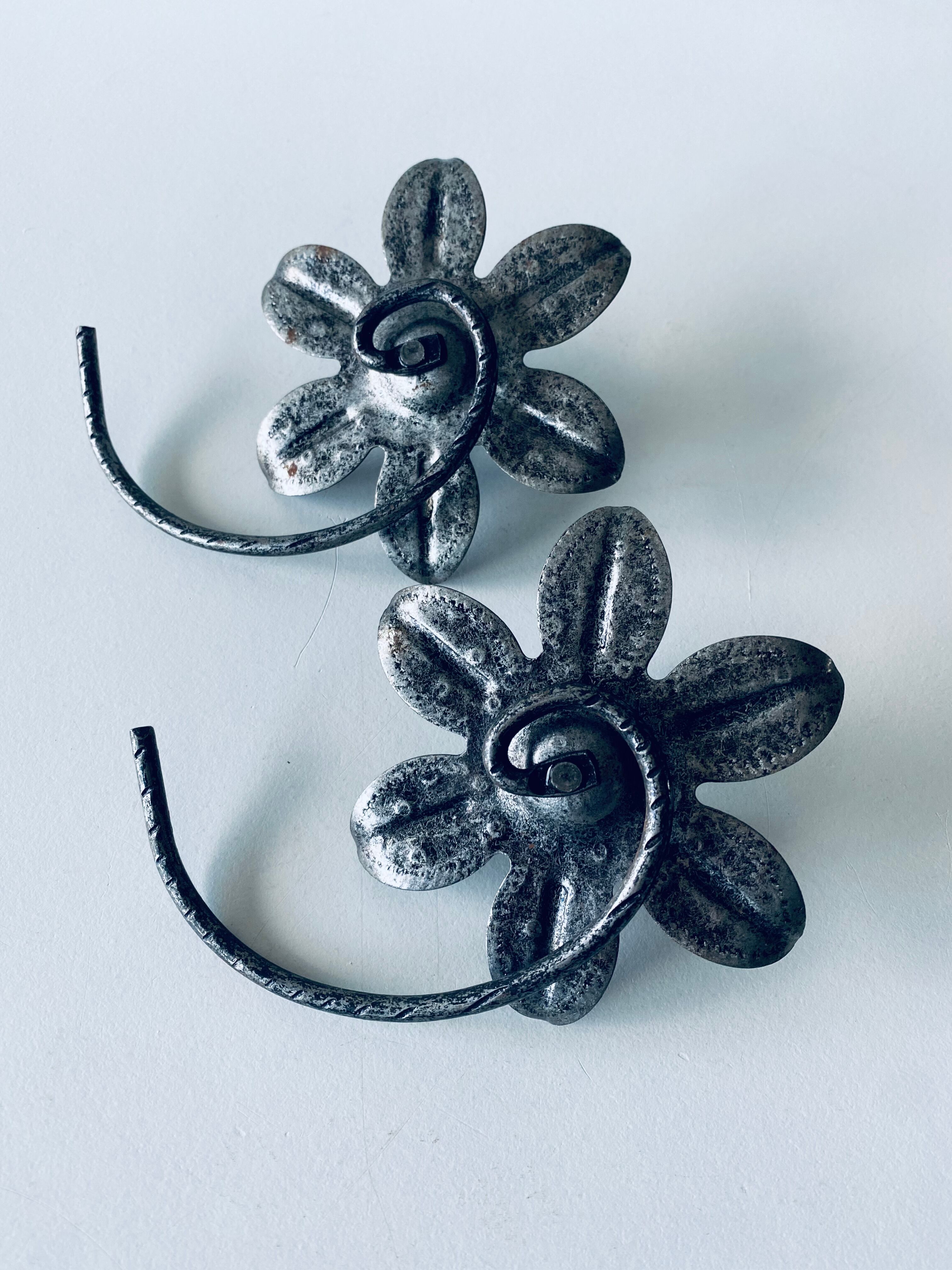 Pair of iron water lily candle holders