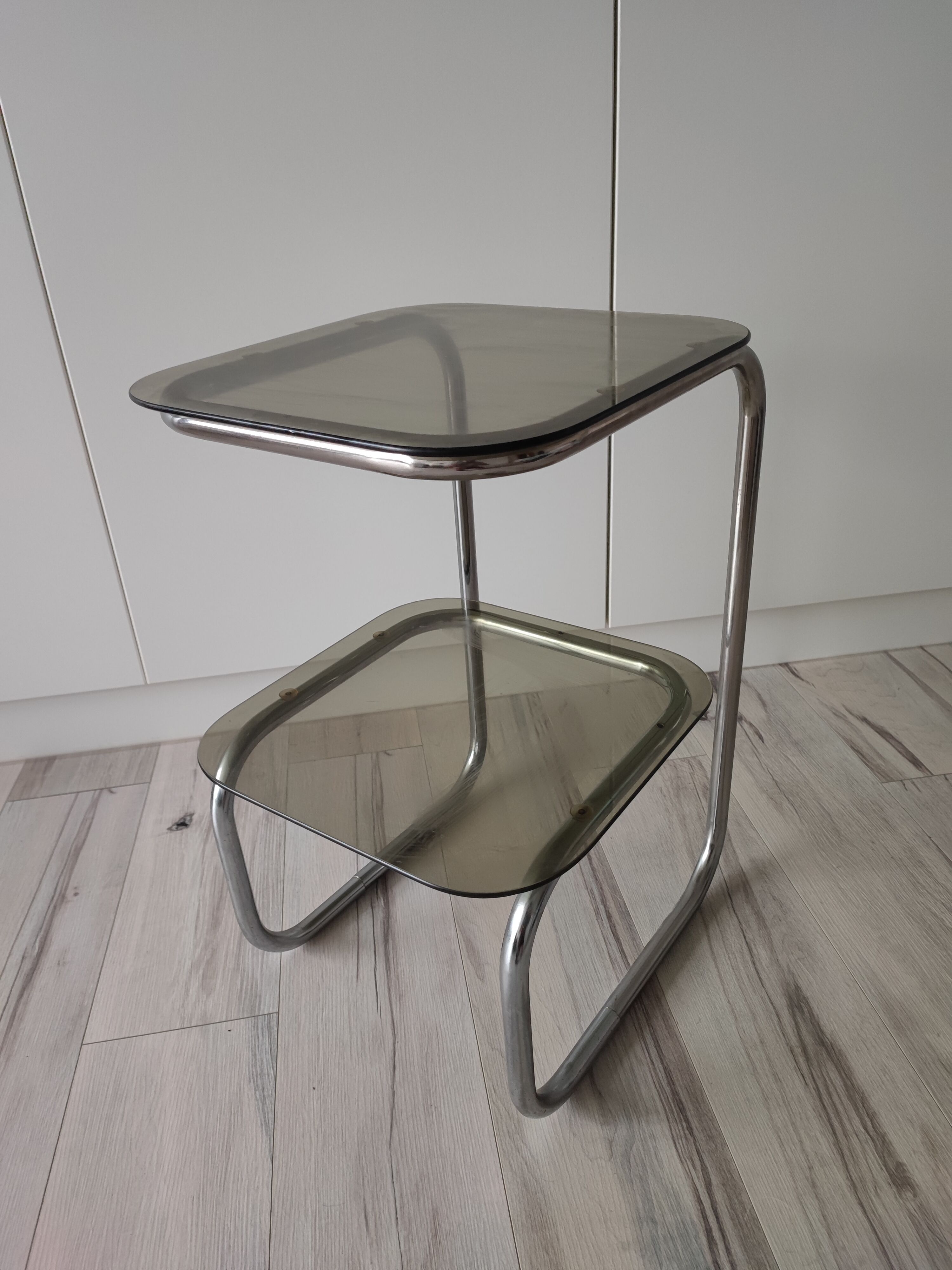 Side table or pedestal table in chrome and glass