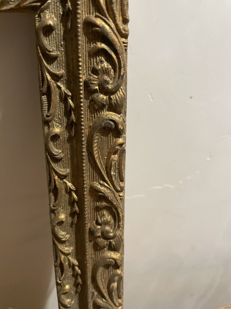 Former wooden frame with gold moulding