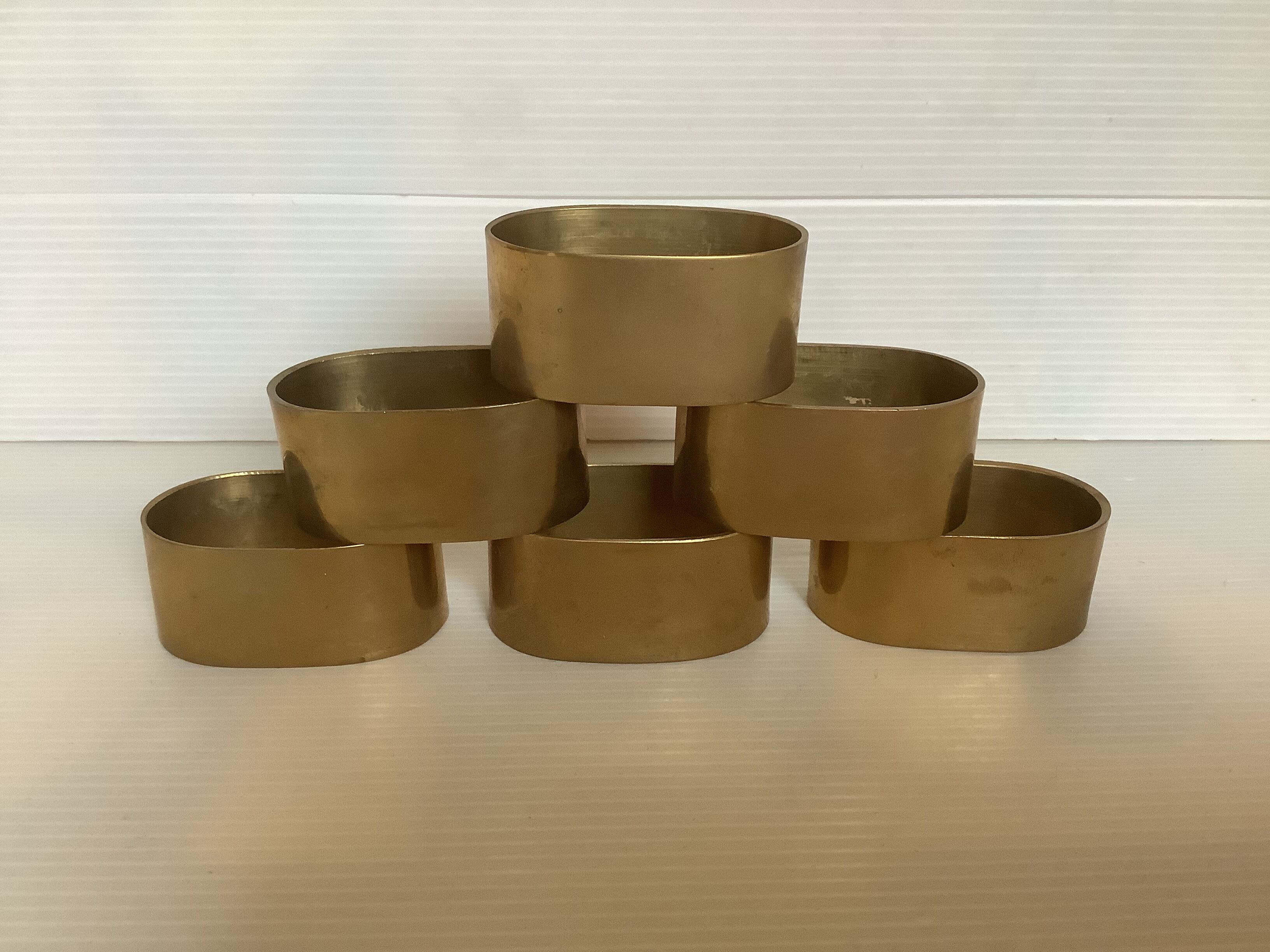 Six old brass napkin rings