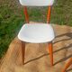 vintage wooden chairs with white faux leather