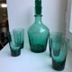 Set of a decanter and 4 design glasses in green glass 70s
