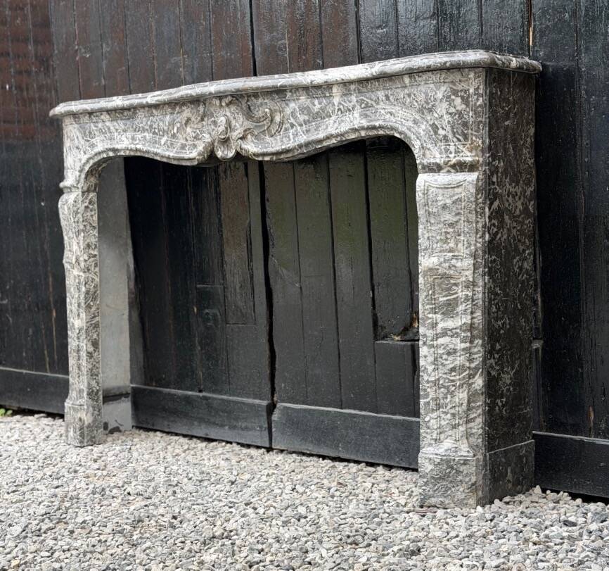 Louis XV fireplace in grey Saint Anne marble, 18th century.