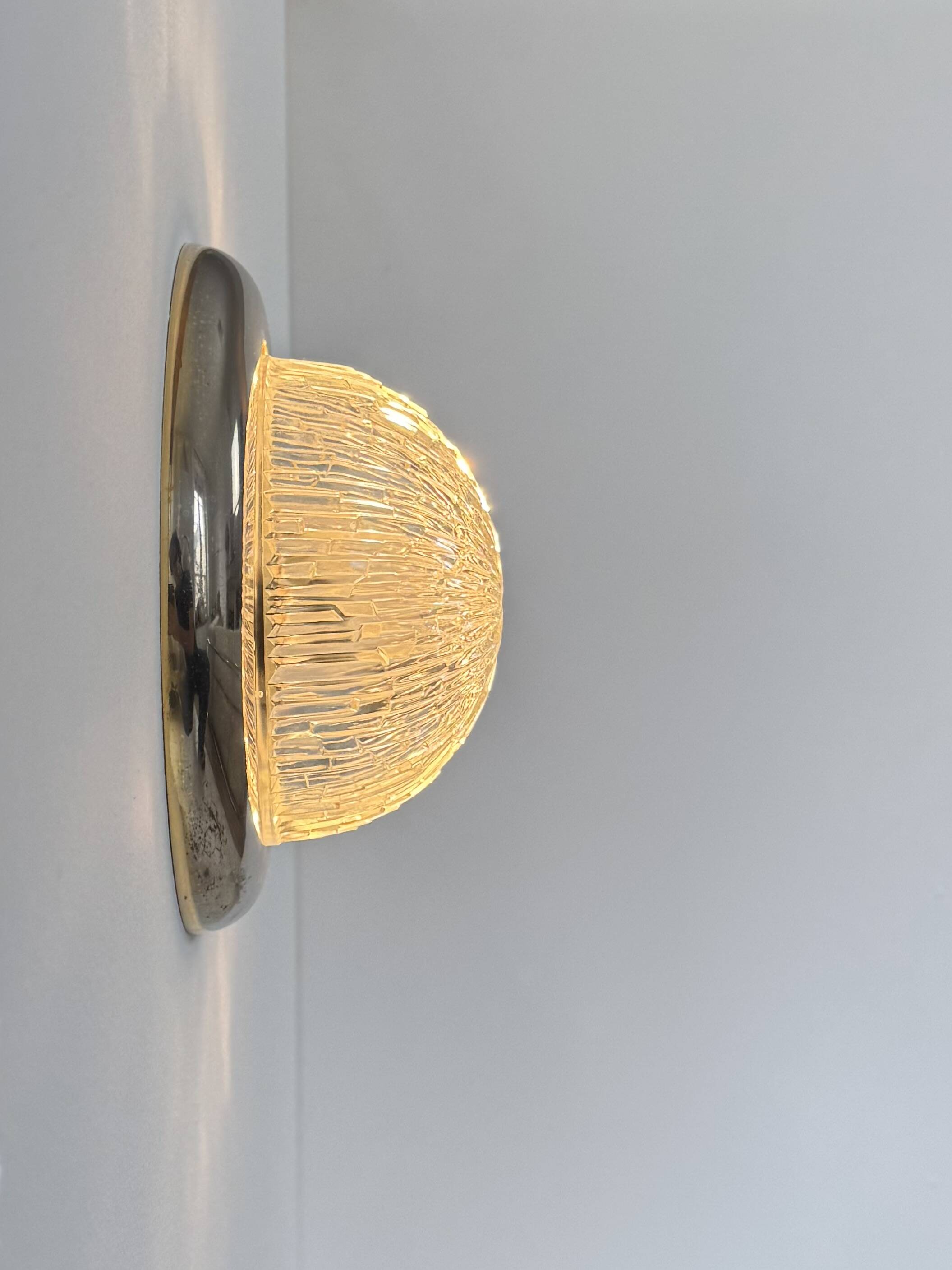 Pair of vintage wall lights, brass and pressed moulded glass, France, 1960.