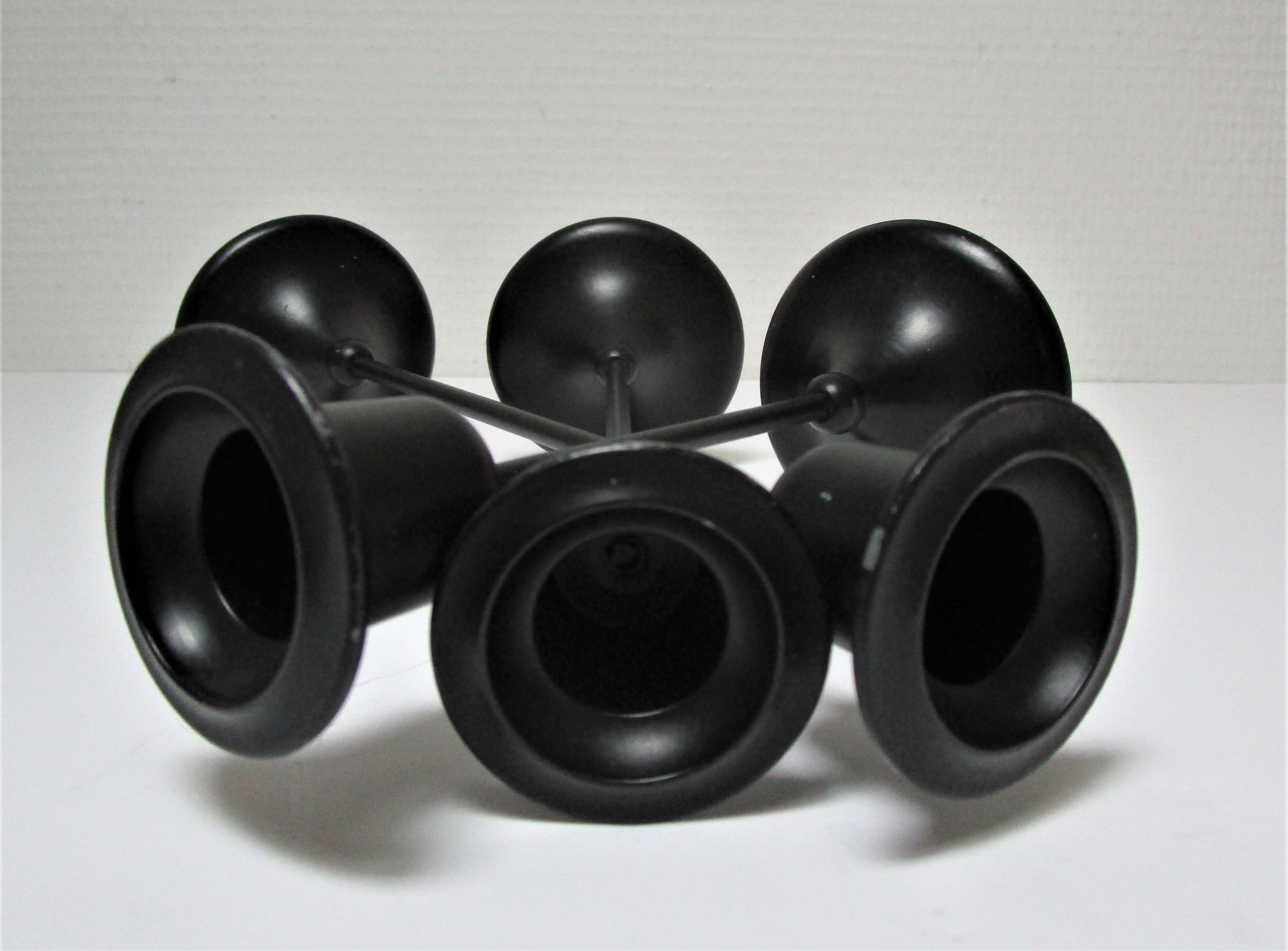 Three Scandinavian black lacquered metal candle holders