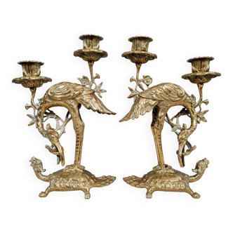 Pair of candlesticks with herons in gilded bronze