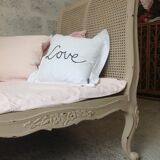 Carved wooden bench and caning bed