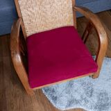 Ancien fauteuil bas colonial style Art Déco en bois.