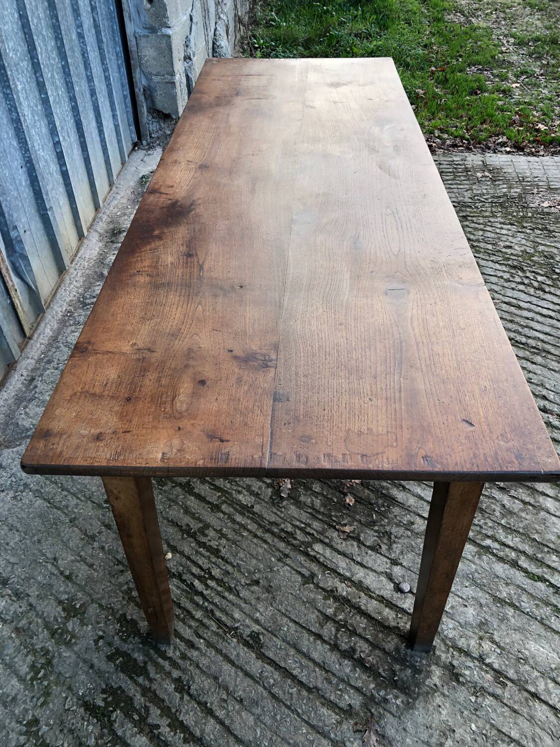 Antique chestnut farmhouse table with 3 drawers on the front.