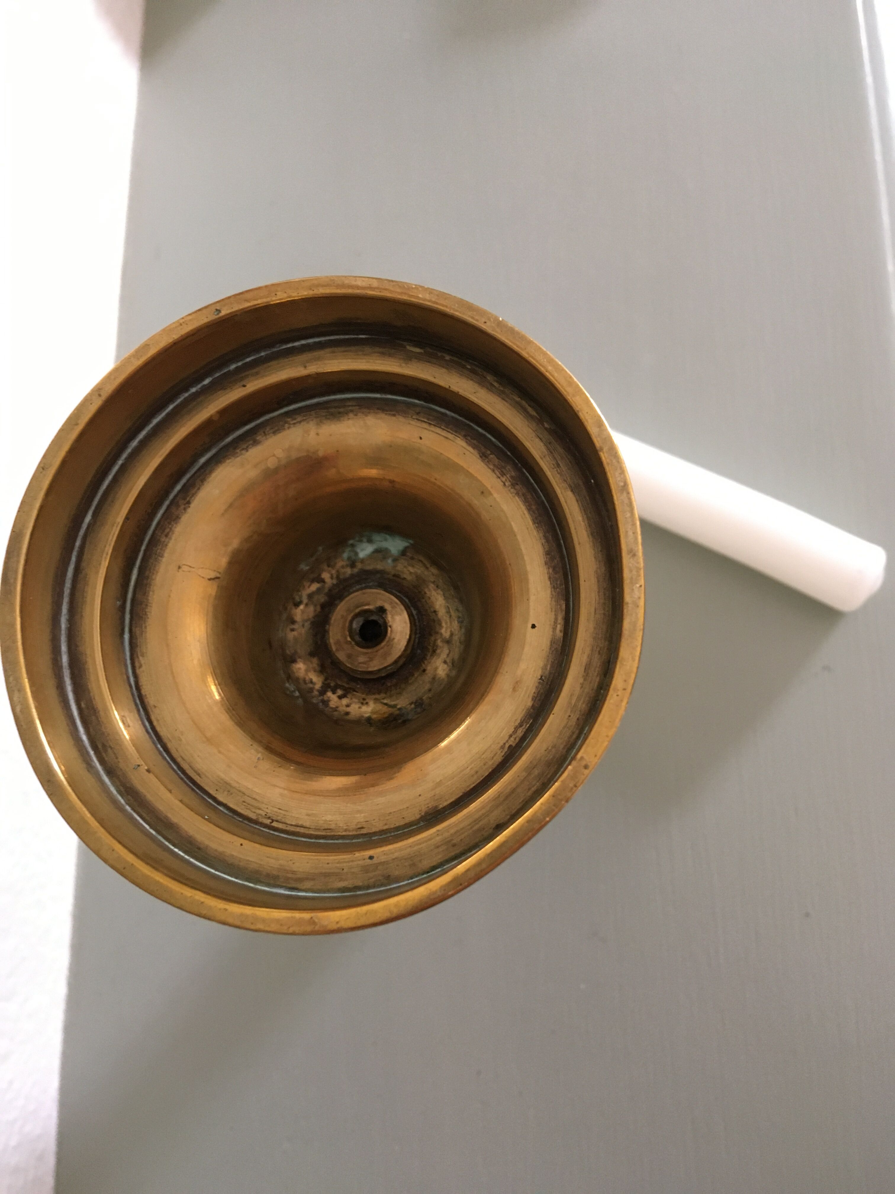 Brass pusher candle holder