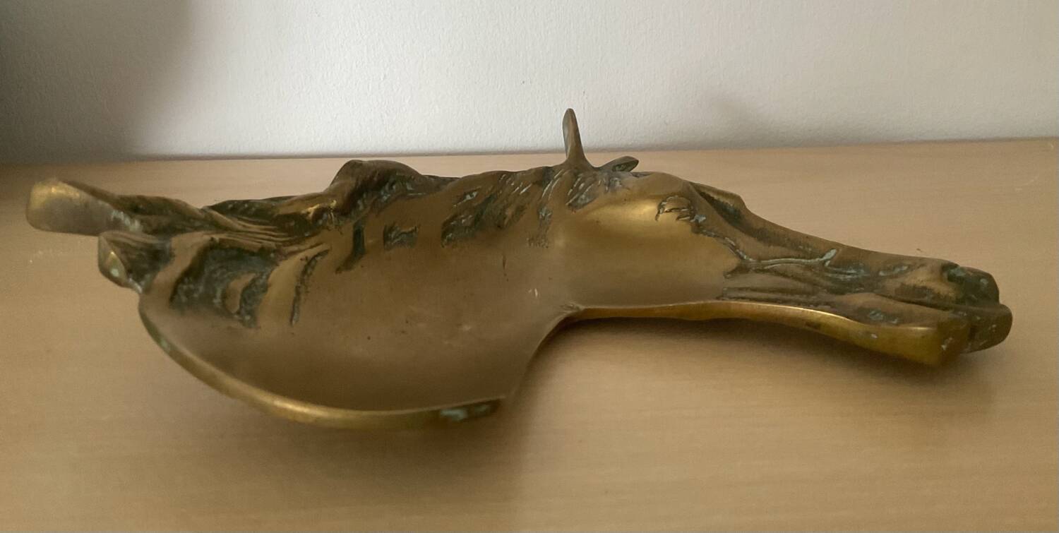 Vintage bronze horse pocket emptier