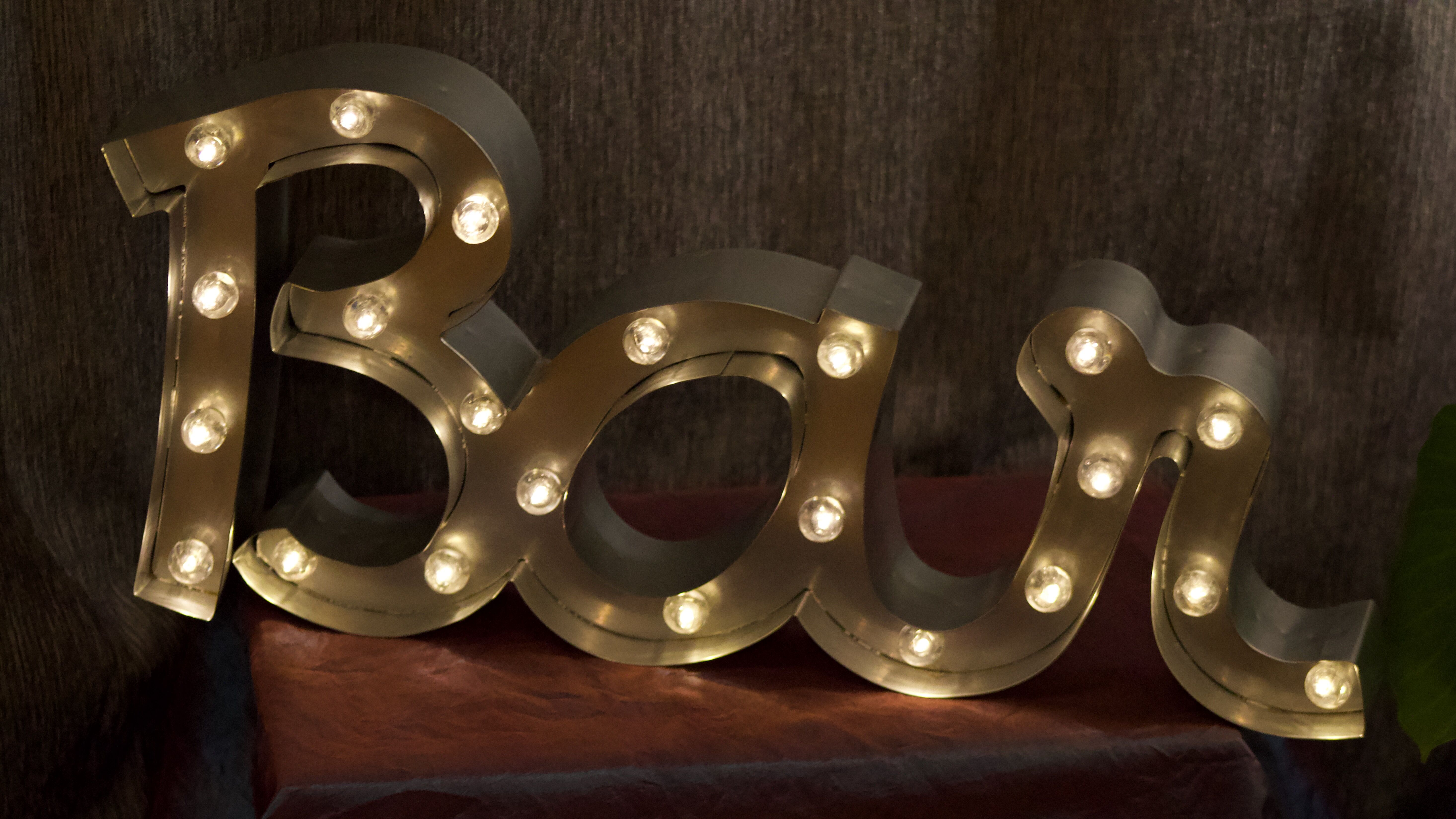 Ancient Light Sign in aluminium lettering forming the word "BAR"