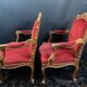 Pair of flat-back armchairs in Louis XV style in red velvet.