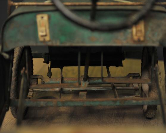 Green metal pedal car