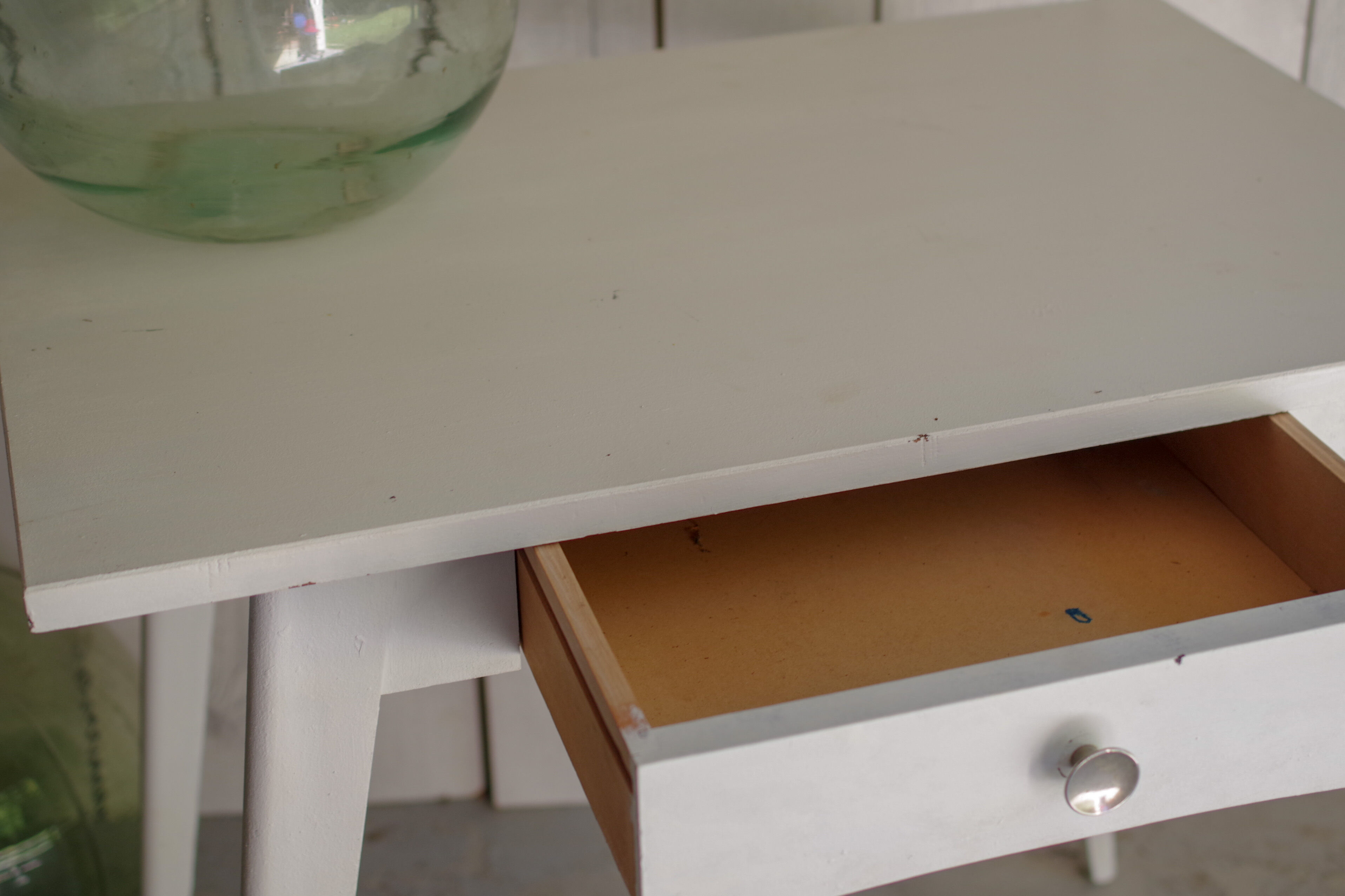 White compass feet table