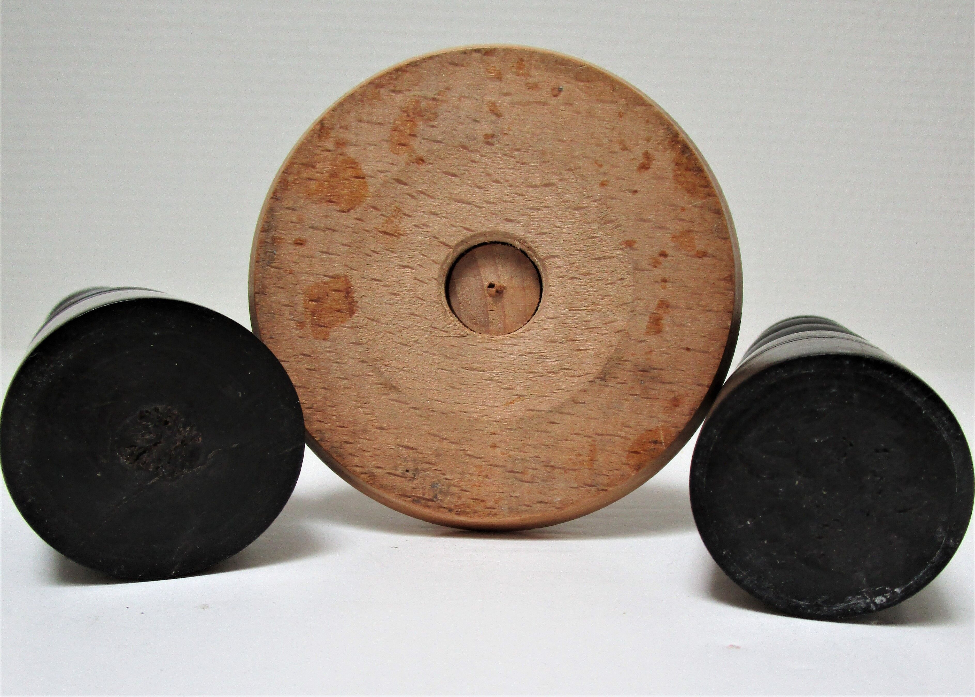 Three vintage light and dark wood candlesticks