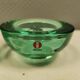 Un ensemble de porte-bougies iittala en verre transparent vert.