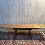 Oak dining table with integrated extensions