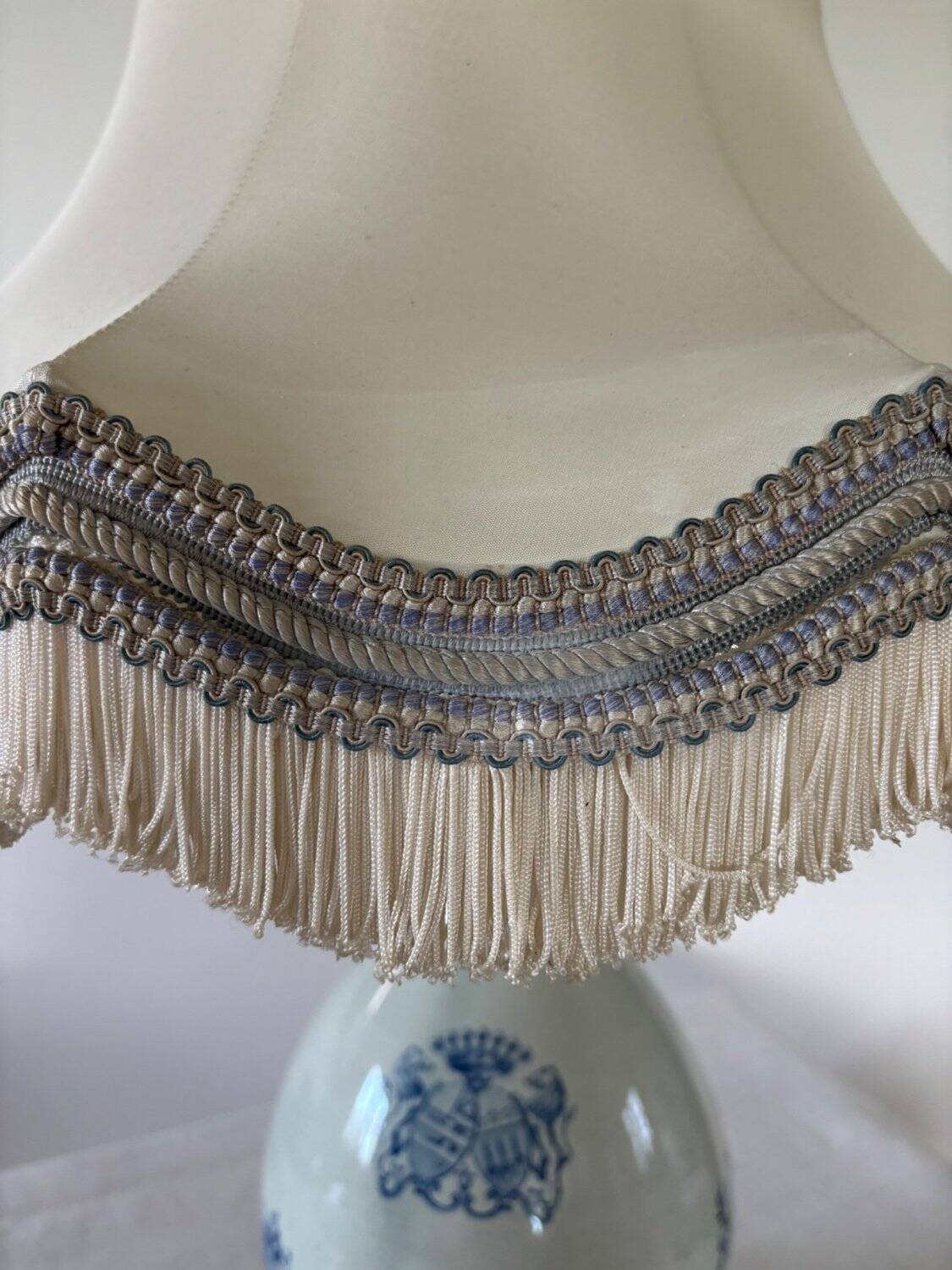 19th-century blue grand feu faience lamp, tripod bronze, fringed lampshade.
