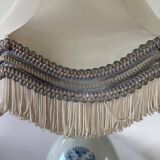 19th-century blue grand feu faience lamp, tripod bronze, fringed lampshade.