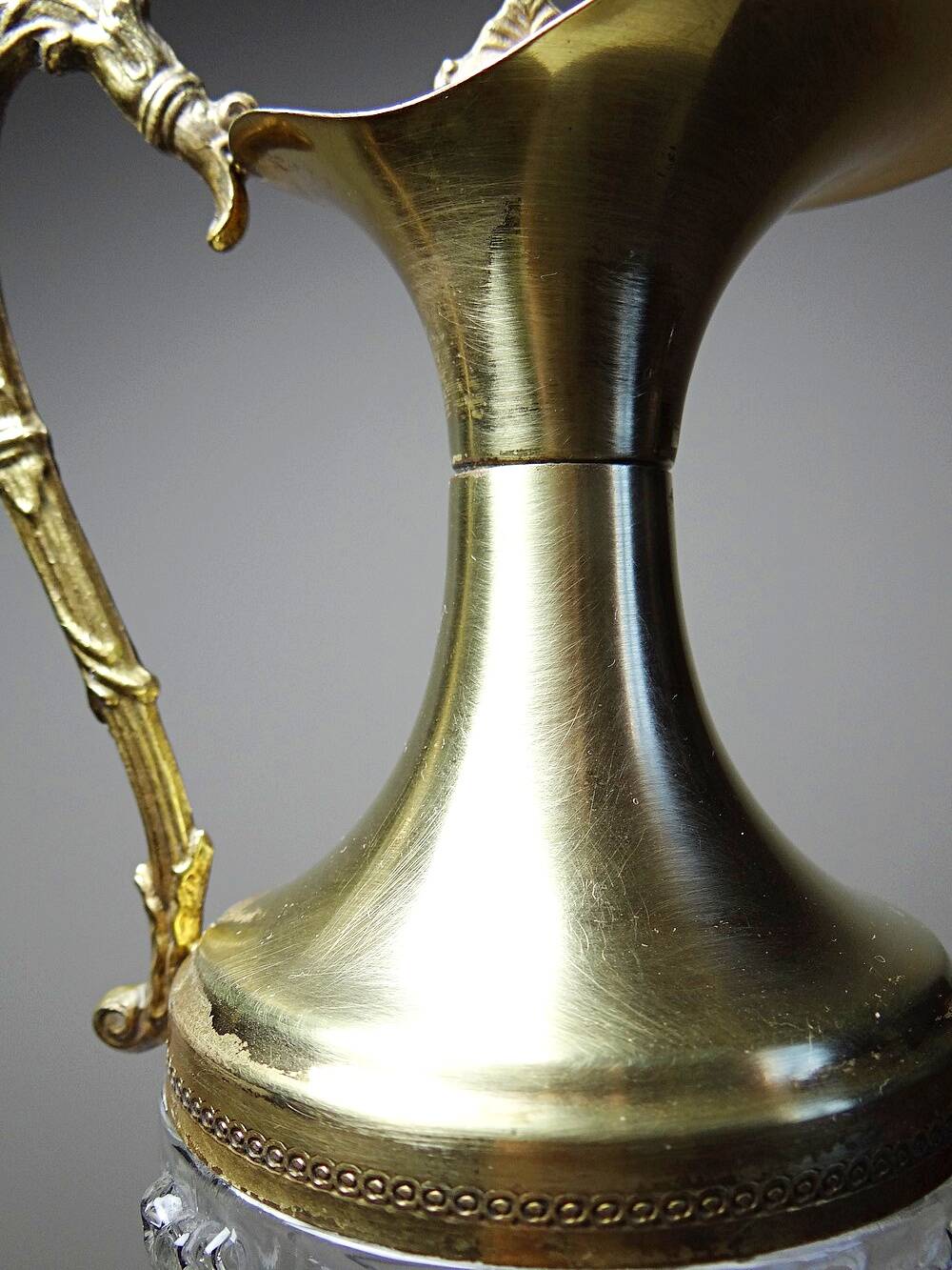 Vintage decorative jug in moulded glass and gilded brass, Italy circa 1980.