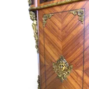 An antique French Louis XVI-style marble-top side cabinet