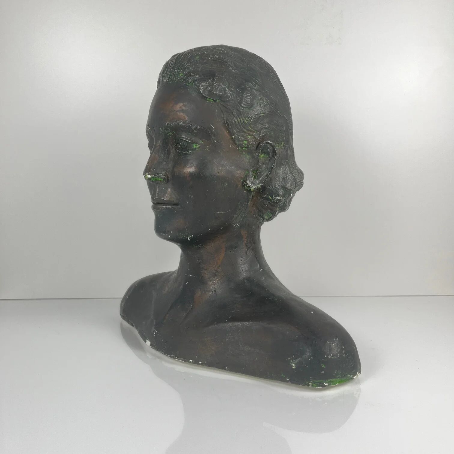 Female bust in neoclassical style in plaster by M. Mongey, 20th century.