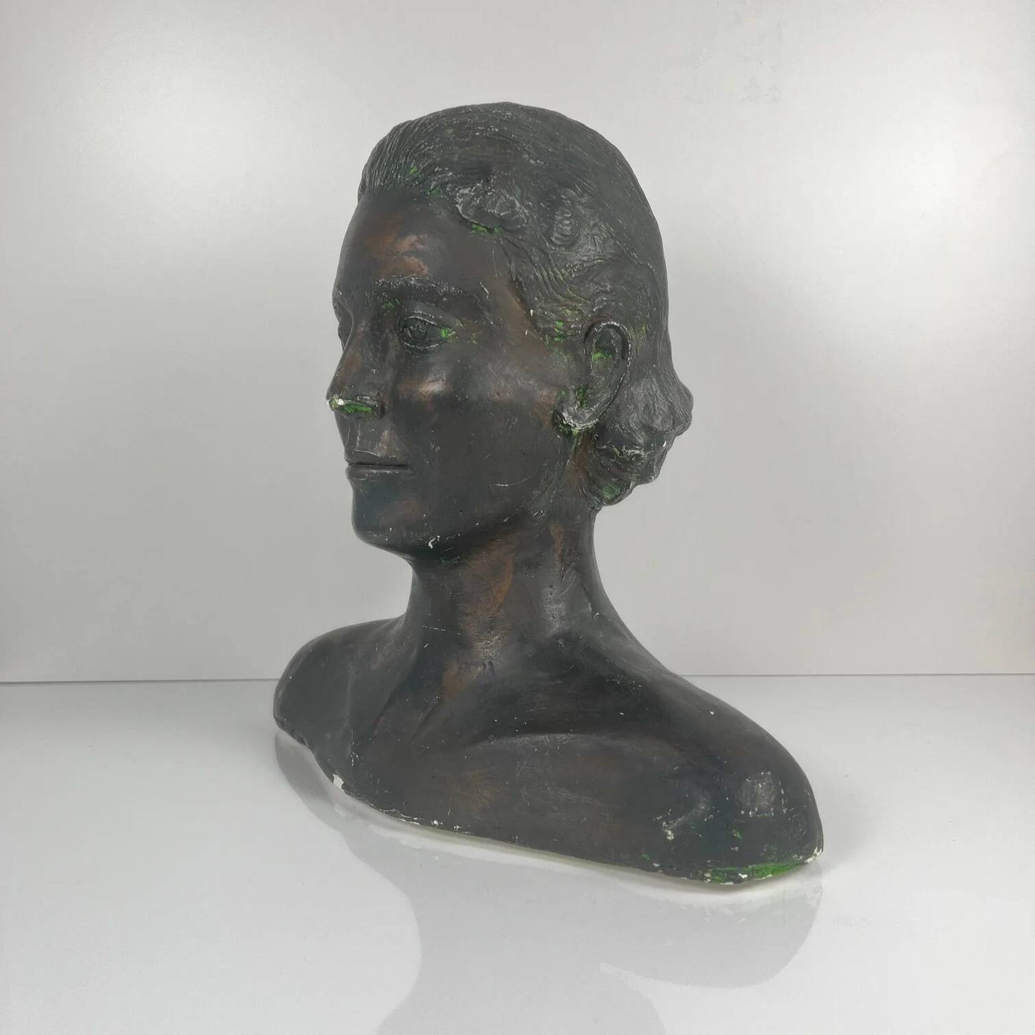 Female bust in neoclassical style in plaster by M. Mongey, 20th century.