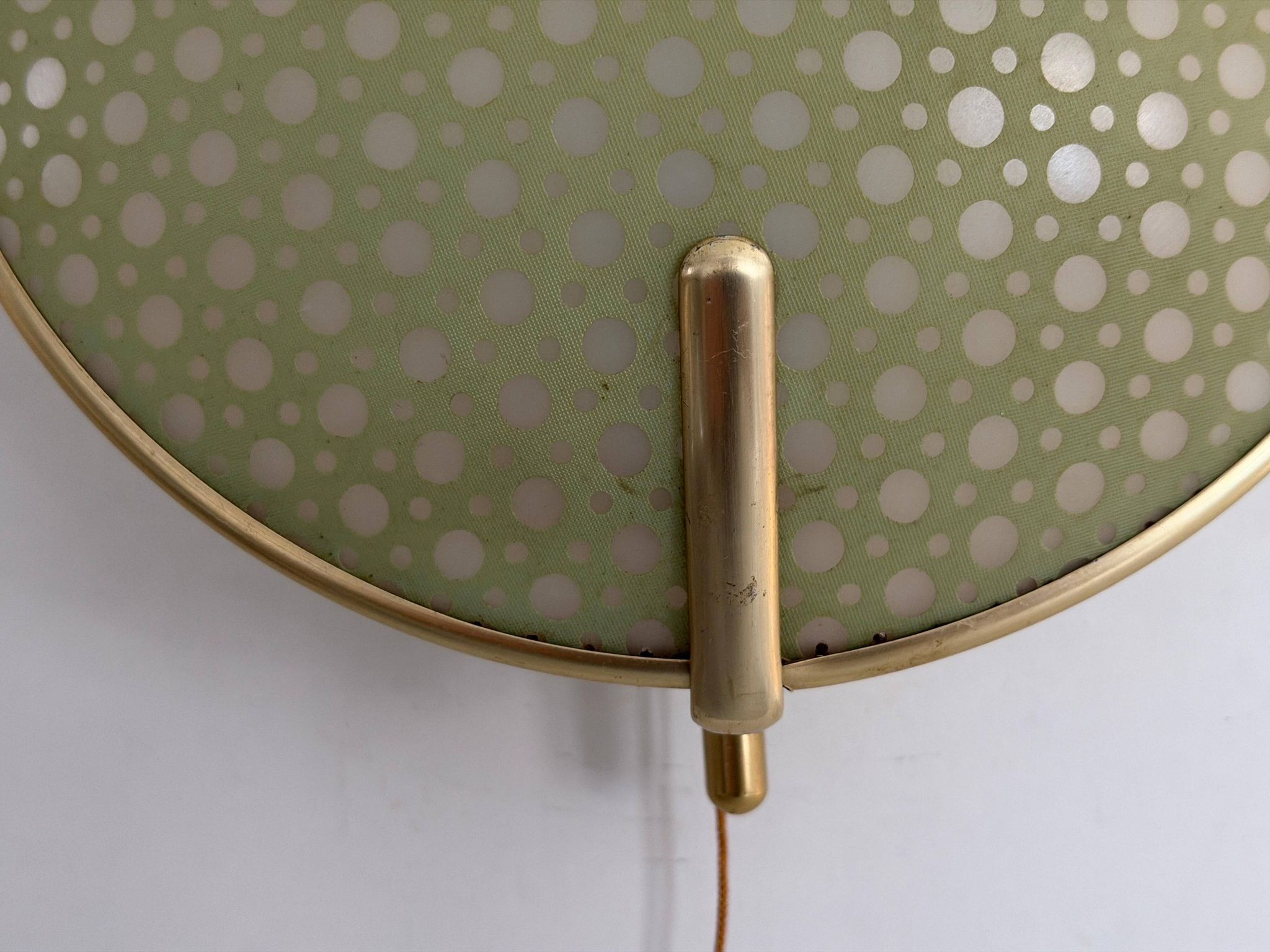 Pair of green plexiglass and gold metal wall lights by Erco, 1950s, Germany.