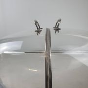 Large serving platter with lid, in silver metal.