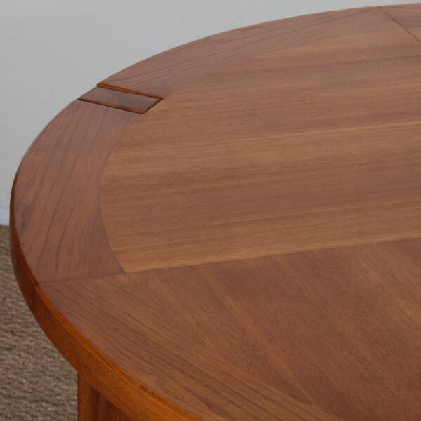 Round extendable dining table in wood published by Monopoly, 1970.