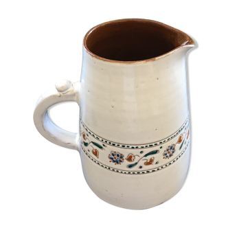 Signed pitcher with floral decoration