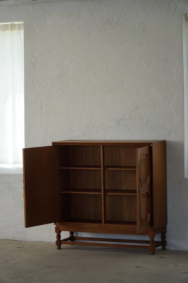 Classic sculptural Danish wardrobe in oak veneer and burl wood, 1950s.