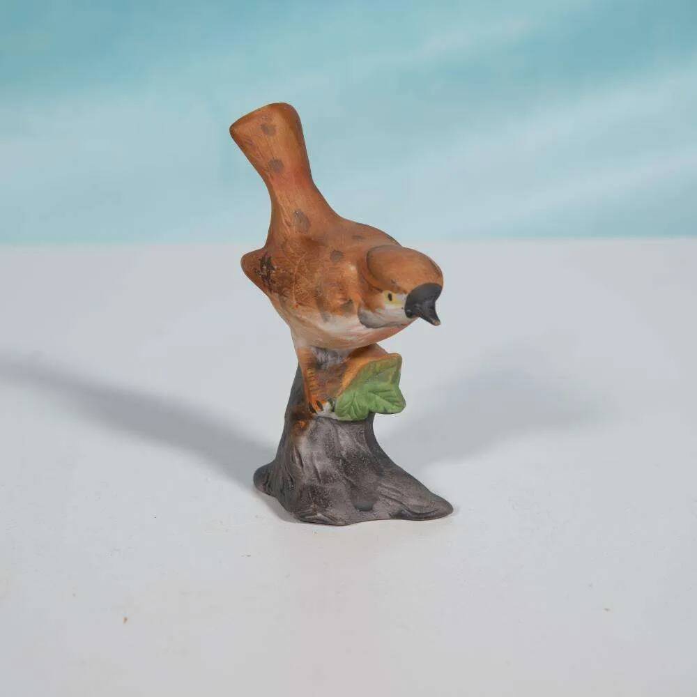 Vintage porcelain bird statuette from the sixties.
