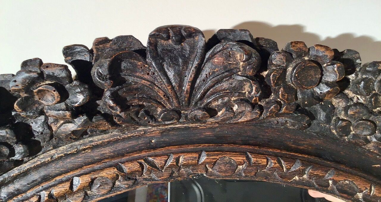 Oval mirror on an 18th century frame