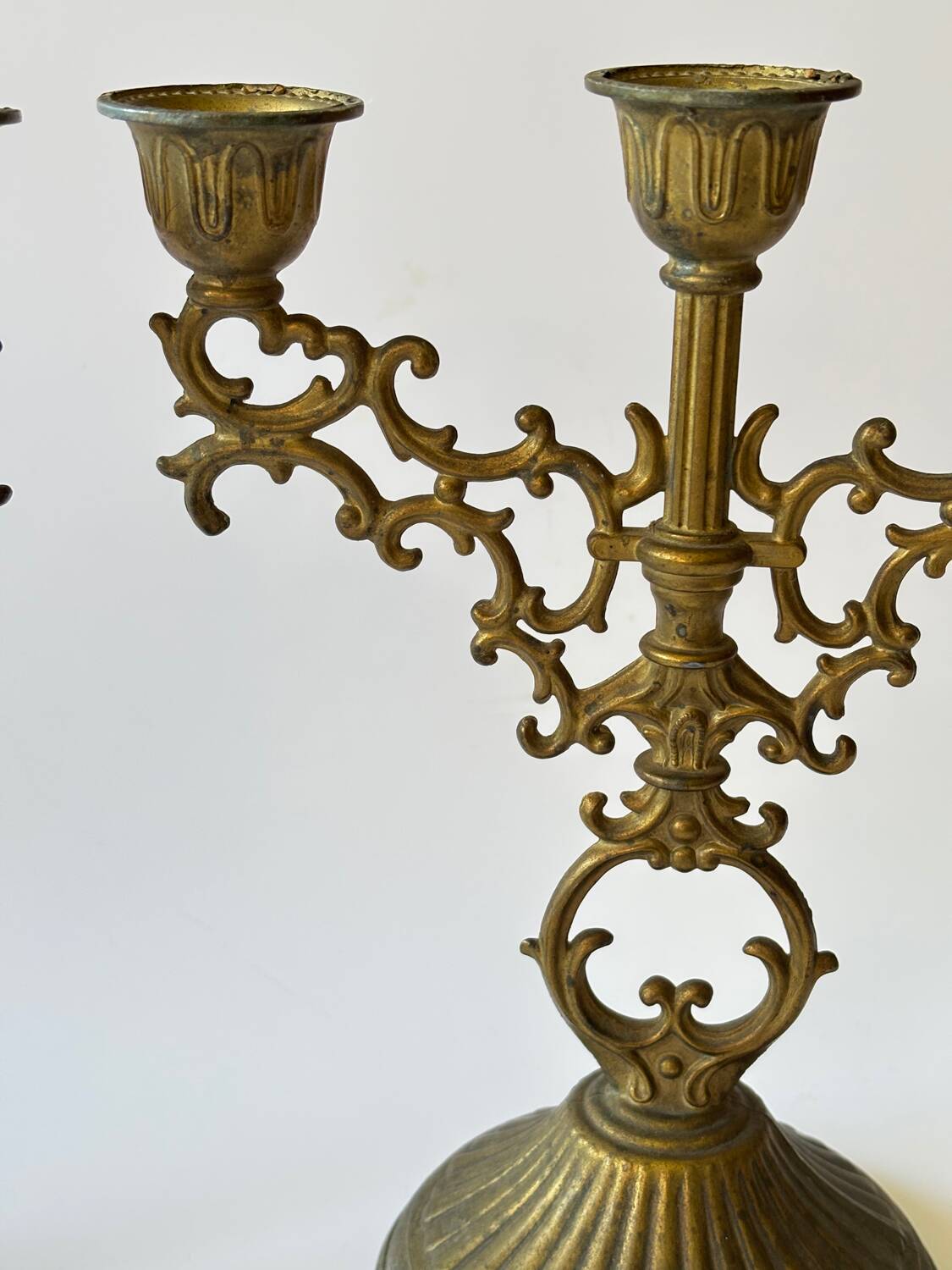 Pair of baroque style brass candlesticks
